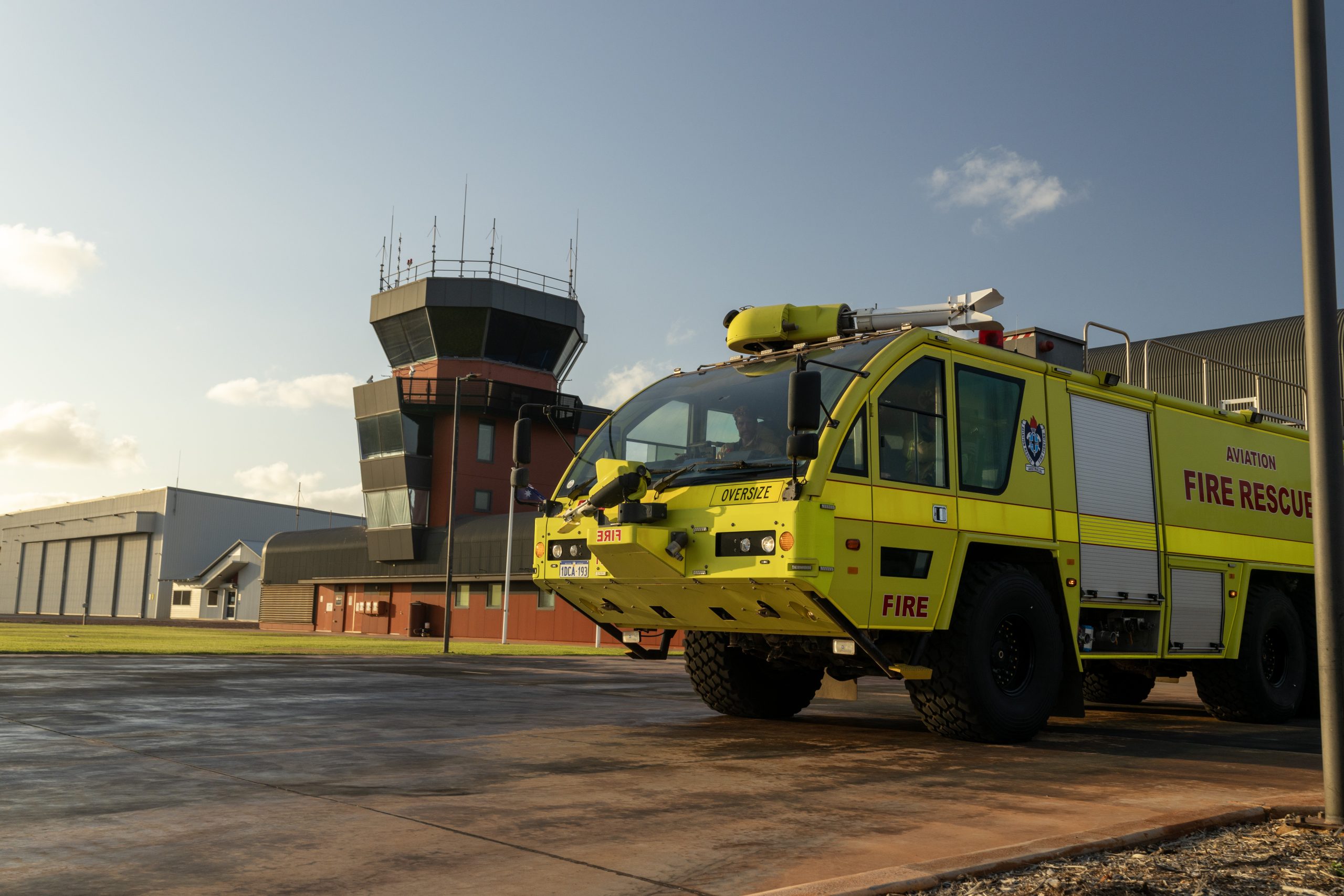 An Airservices Australia rescue vehicle outside a fire station